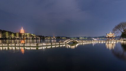 Fototapeta premium Hangzhou Leifeng Pagoda landscape at night, view from the Long Bridge Park beside West Lake, Hangzhou, China