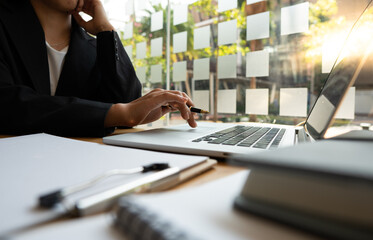 close up of a hands typing on a laptop