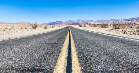 Route 66 in the desert with scenic sky. Classic vintage image with nobody in the frame.