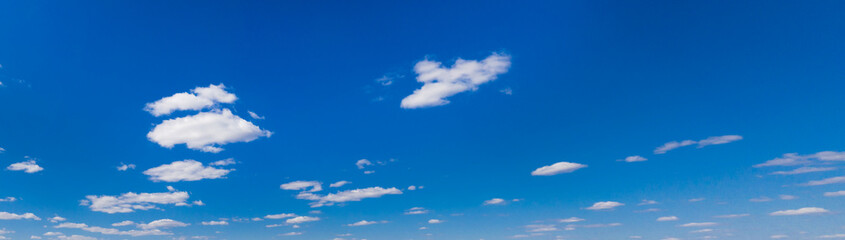 Panoramic fluffy cloud in the blue sky. Sky with cloud on a sunny day.