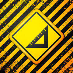 Black Triangular ruler icon isolated on yellow background. Straightedge symbol. Geometric symbol. Warning sign. Vector