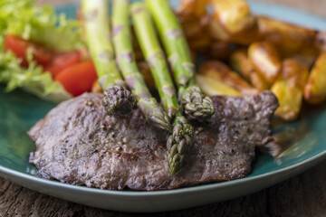 asparagus on a grilled steak