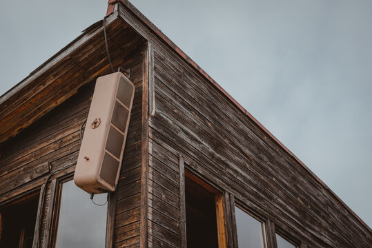Low Angle Shot Of A Broken Air Conditioner On A Wooden Building In Latvia