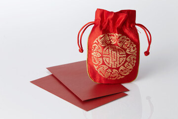 red lucky bag and red envelope on white background