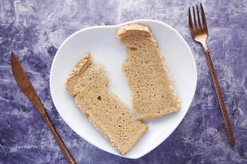 close up of slice of baked bread on plate on table 