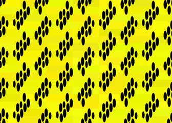 black abstract spots on a yellow background.