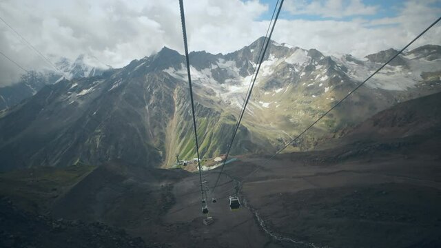 View from the cable car in the mountains. View of the slopes of Mount Elbrus. Caucasus, Russia.