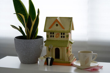 wedding decoration with plant bride and groom figurine on white table top
