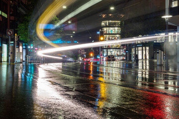 Switzerland, Zurich - November, 2020 - Night lights at shopping street Bahnhofstrasse with tram