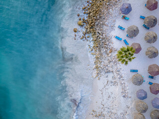 Aruba Caribbean white beach with palm trees and luxury swimming pool Aruba Caribbean sea