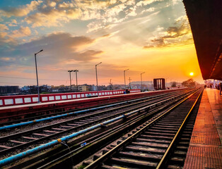 Fototapeta na wymiar sunrise over railway tracks at morning from flat angle
