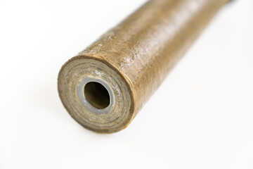 Dirty filter cartridge drinking water on a white background. Replacing cartridges is a mandatory procedure that must be carried out to maintain quality water purification. Pollution.