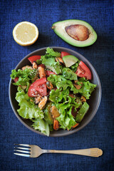 Healthy salad with avocado and mussels. Diet food. Keto salad.