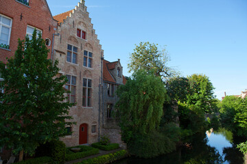 Fototapeta na wymiar Street with old houses in Bruges, an Unesco World Heritage Site in Flanders, Belgium, Europe