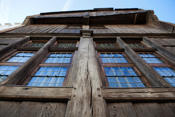 Obraz premium Facade of an old Medieval wooden house in the center of Bruges, an Unesco World Heritage Site in Flanders, Belgium, Europe