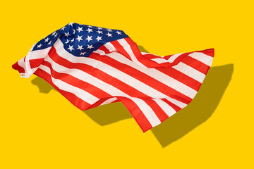 the United States of America flag on a yellow background