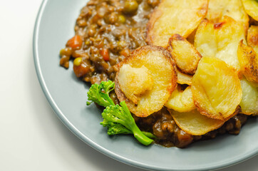 Minced beef hotpot, tender british beef in a warming gravy with carrots and peas, all topped with sliced roast potatoes