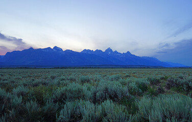 Colorful sunset sky over the mountain peaks in Grand Teton National Park in Wyoming, United States