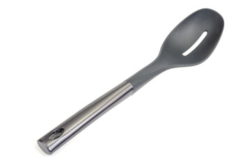 Plastic culinary black spoon, slotted spatula, kitchen gadget. Kitchen utensil. Isolated