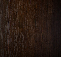 Background of brown lacquered board with well visible vertically located fiber