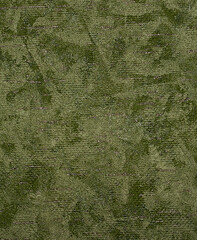 Abstract background made of embossed paper with green stains