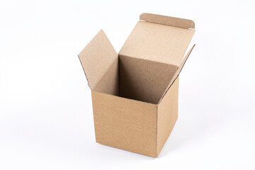 Open cardboard box light brown on a light background. Cardboard box without inscriptions for packing gifts, various things