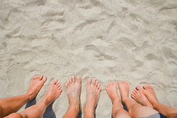 A Feet on the sand of happy people by the sea on nature travel