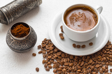 Coffee and coffee grains.  The coffee grains are ground in the coffee grinder.