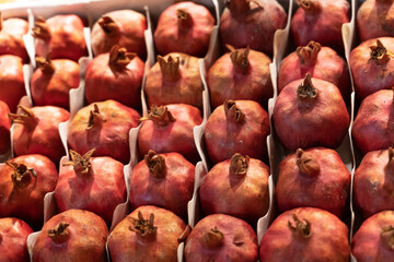 fresh pomegranates on the counter for making fresh juice