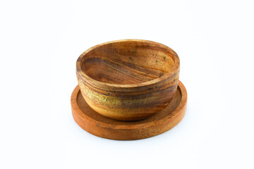 Mahogany bowl with wooden placemat on isolated white background
