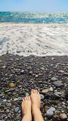 human feet on the background of the seascape