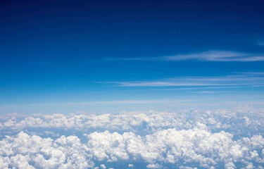 Fototapeta na wymiar Nice sky and clouds view through airplane window