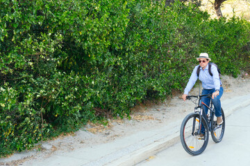 Hispanic man leaving work on a bicycle