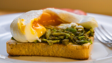 Sandwich with avocado and poached egg