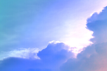 Soft cloud on sky subtle background colorful pastels tone with blue, purple and white color. The light of the sun on evening.
