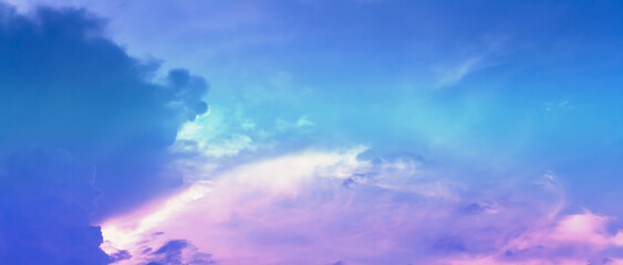 Obraz premium Soft cloud on sky subtle background colorful pastels tone with blue, purple and white color. The light of the sun on evening.