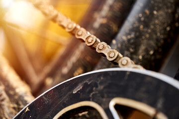 Bicycle chain before entering the front gear wheel to drive the vehicle, Abstract Macro with narrow depth of field.