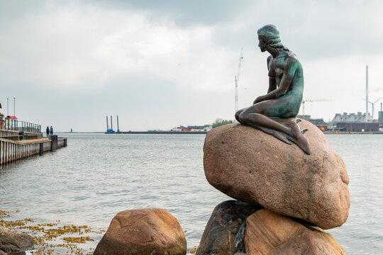 Copenhagen, Denmark - May 21, 2016: A picture of the iconic The Little Mermaid in Copenhagen, the bronze statue by Edvard Eriksen.