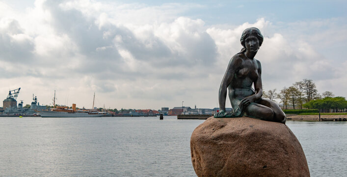Copenhagen, Denmark - May 21, 2016: A picture of the iconic The Little Mermaid in Copenhagen, the bronze statue by Edvard Eriksen.