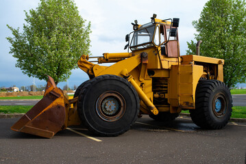 large yellow tractor loader bulldozer heavy dirt