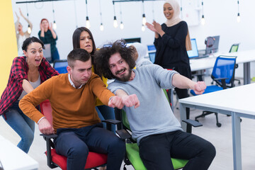 Group of  Creative office workers collaborate together making joke with each other during their work inside office. succes and competition business concept