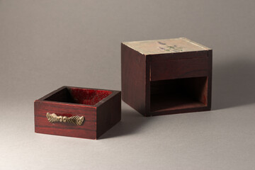 Brown wooden drawer with metal gold decoration handle and box box made of wood.
