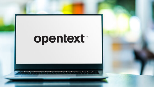 Laptop computer displaying logo of OpenText