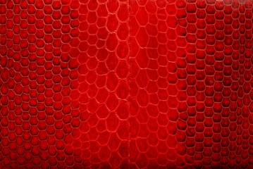 red black texture of genuine leather reptile scales on the bag