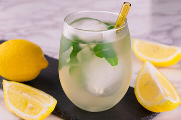 A glass of lemonade with mint and ice.
Refreshing drink.