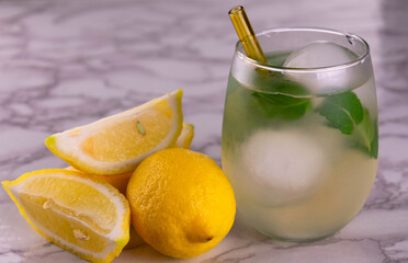 Lemon drink with mint and ice.
Close-up.