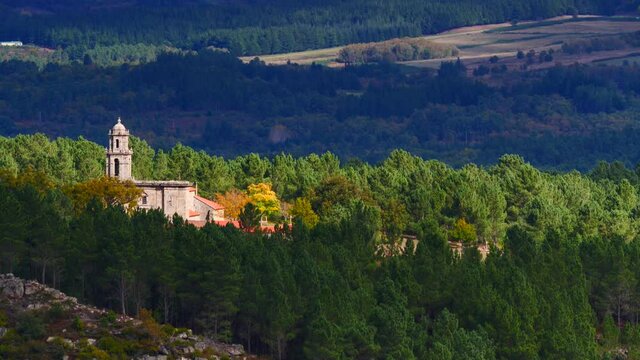 Green mountain view with old church over river Sil Canyon in Parada de Sil, Galicia, Spain. View from Balcon de Madrid lookout. Tourist place.