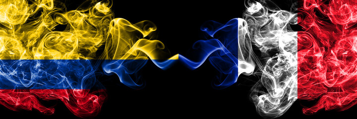 Colombia, Colombian vs France, French smoky mystic flags placed side by side. Thick colored silky abstract smokes flags.