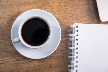 notepad with cup of coffee