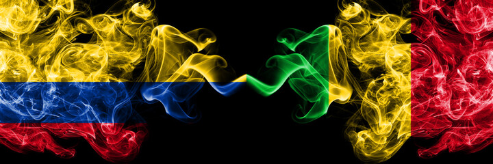 Colombia, Colombian vs Mali smoky mystic flags placed side by side. Thick colored silky abstract smokes flags.